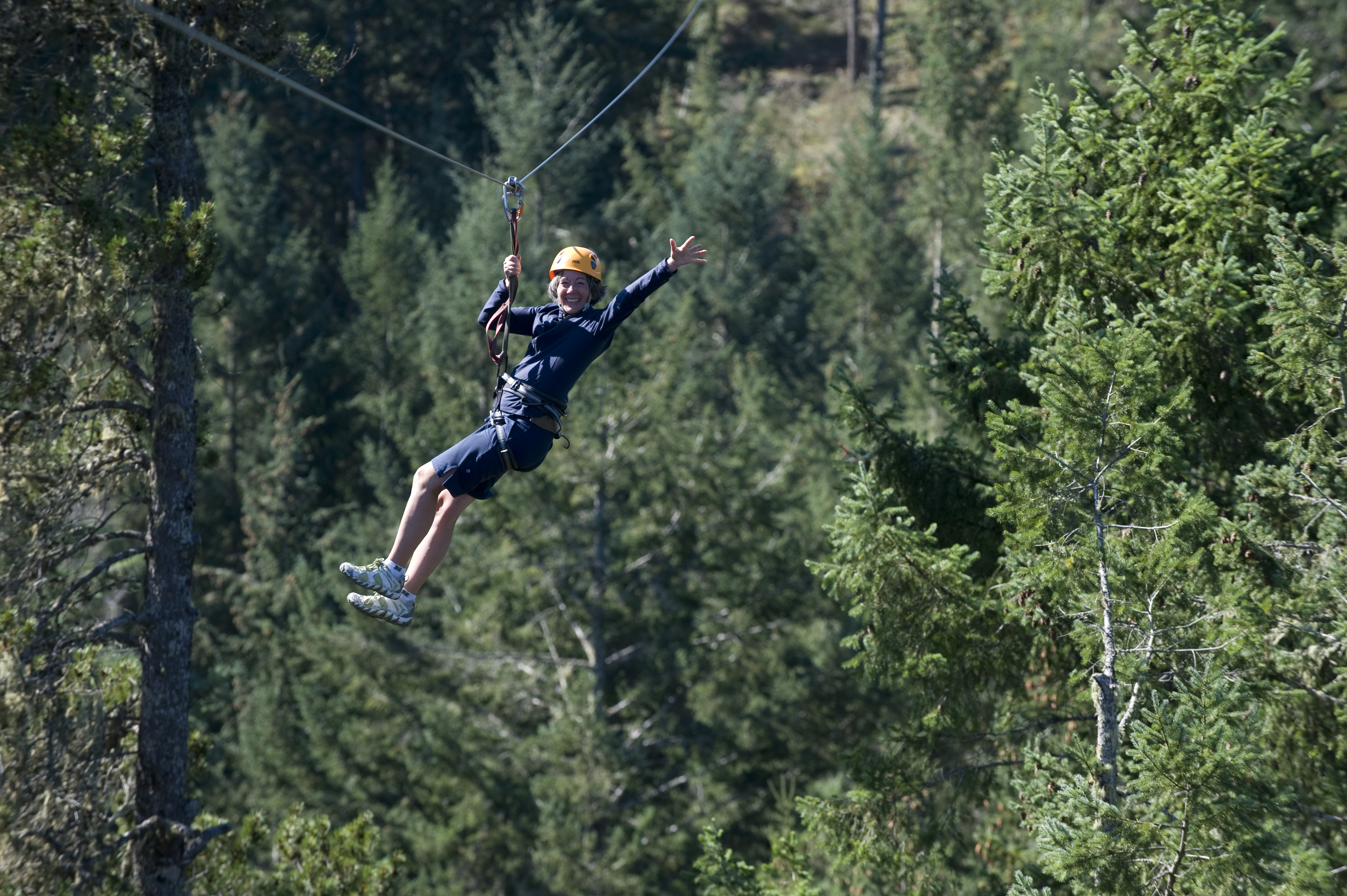A woman on a ziplining course