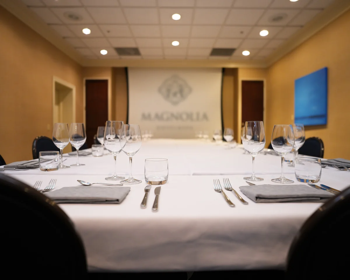A boardroom set up for a 3-course dinner service