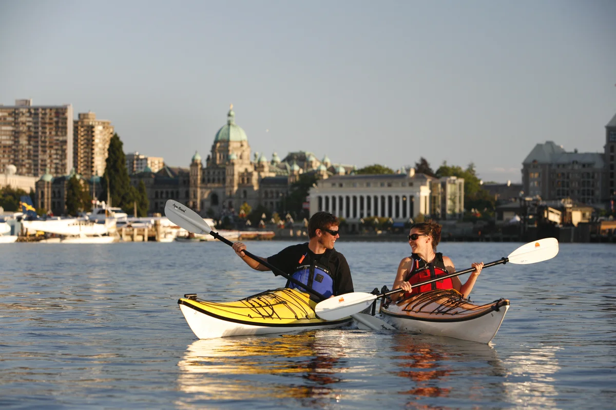 Two kayakers on the Inner Harbour in Victoria BC