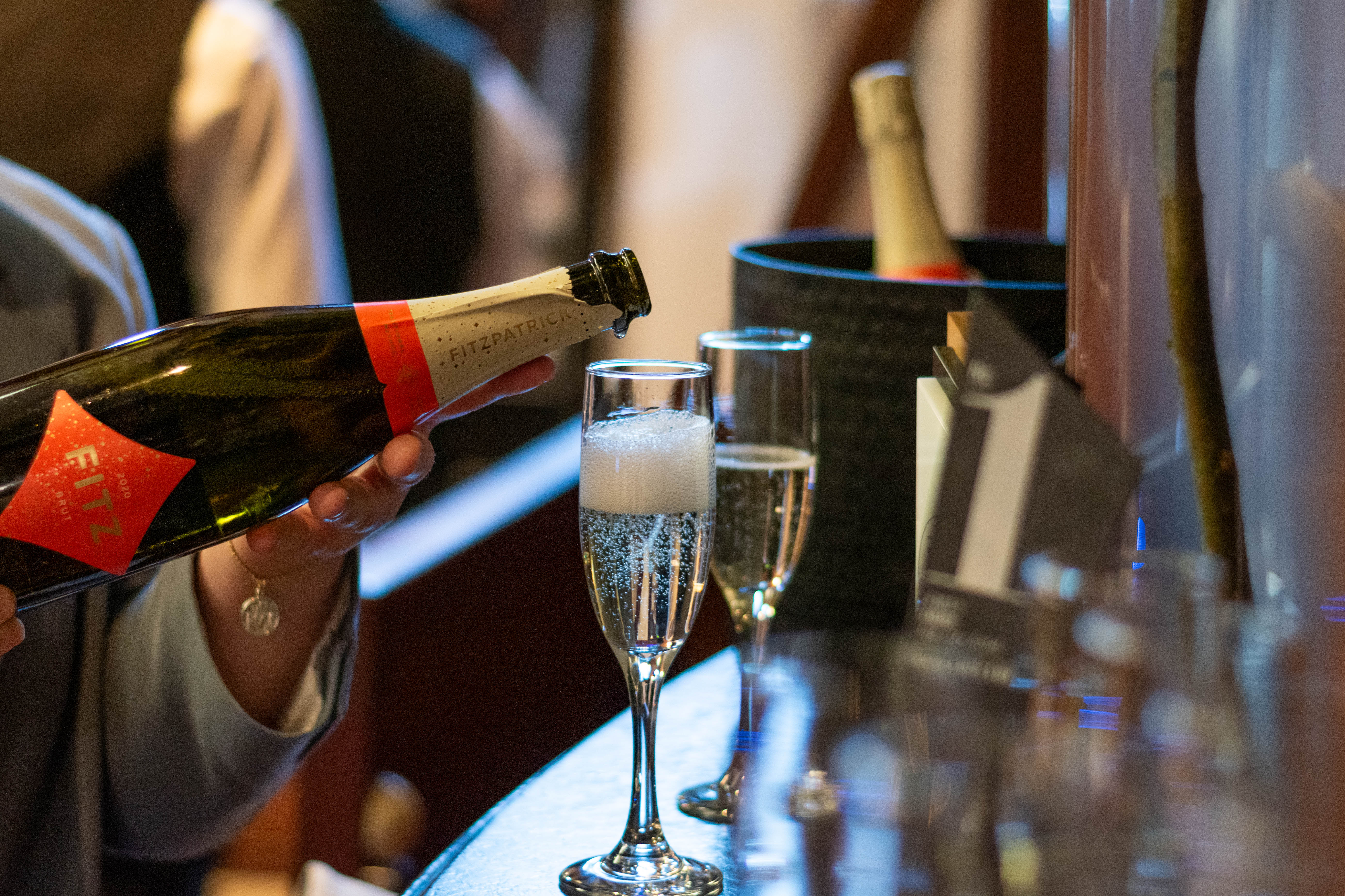 Pouring sparkling wine at Magnolia Hotel & Spa