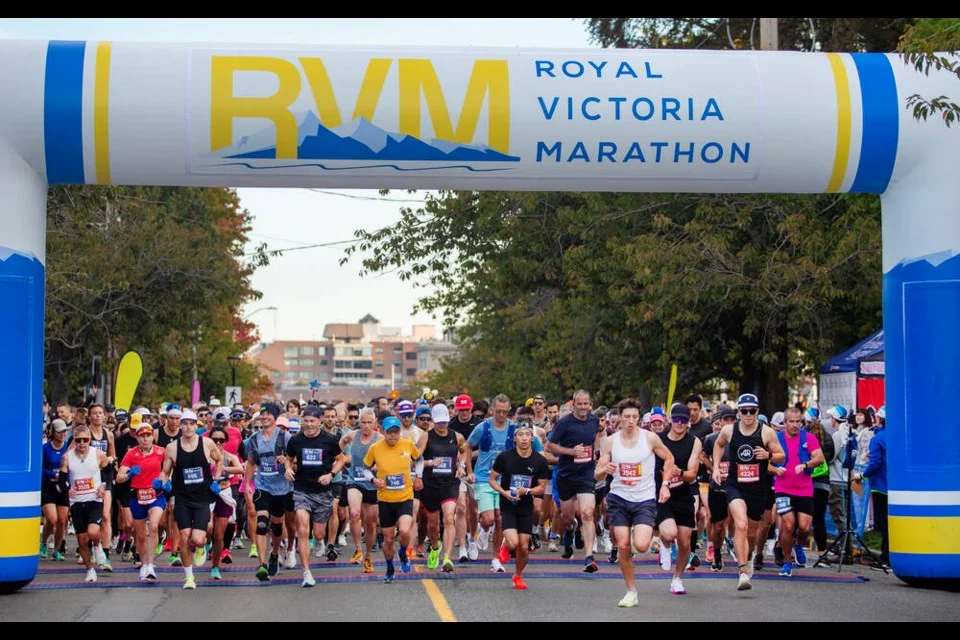 Runners crossing the finish line of the Royal Victoria Marathon